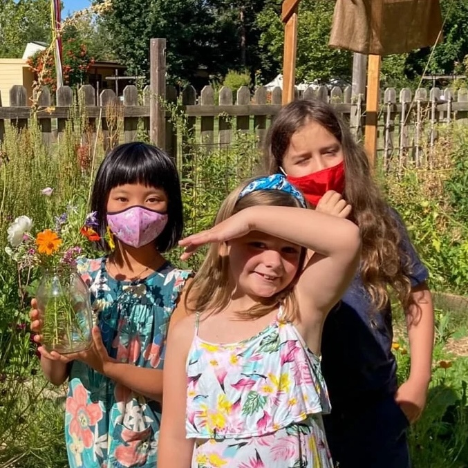 Three students in the flower garden