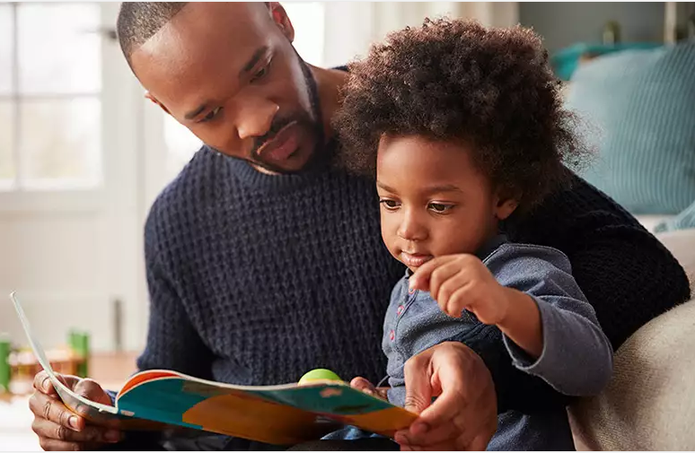 Parent and child reading a book